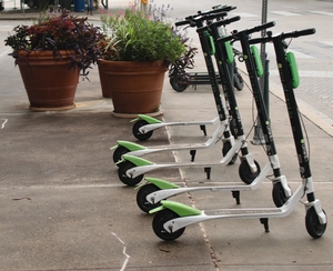Lime Scooters on sidewalk Lime Scooters on sidewalk