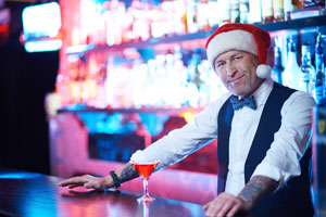 Bartender with Santa hat for the holidays