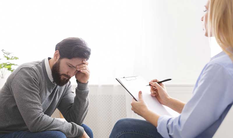 Man and Therapist in Counseling Session